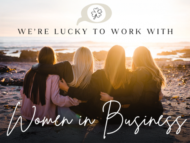 Women sitting together on the beach